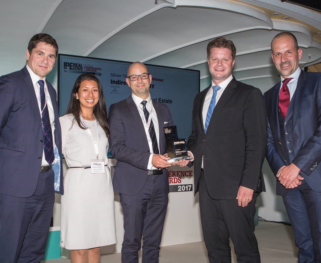From left to right: Andrew Strachan, Roxana Wagner and Jerome Berenz from the Indirect Investment Team of ARE receiving the IPE Award for Indirect Strategy